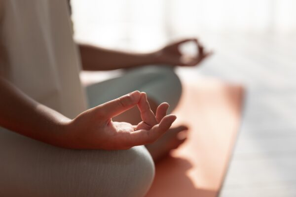 Close-up of a person meditating during yoga and meditation classes near you at VYASA.