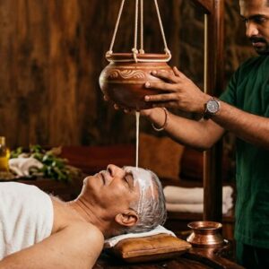 Indian man taking shirodhara by milk for panchakarma centre in Tollygunge in VYASA Kolkata