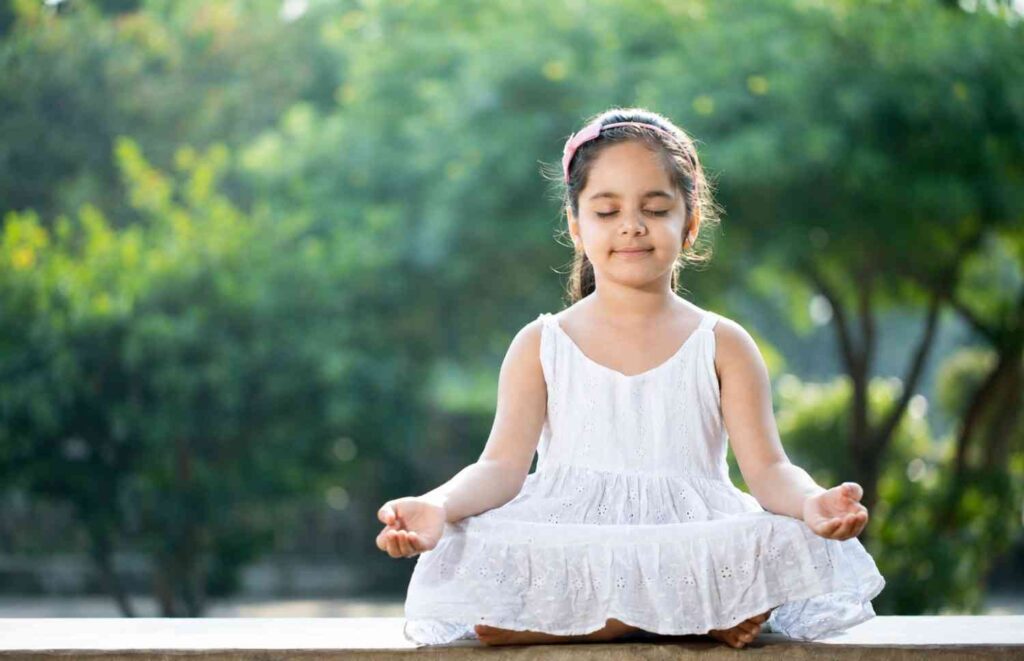 A small girl is performing Yoga for Kids in Tollygunge
